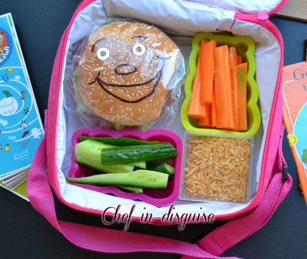 Lunch box with smiling sandwiches