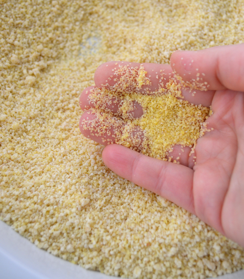 Note the difference in the size of the bulgur in my hand and the maftoul granules in the pan