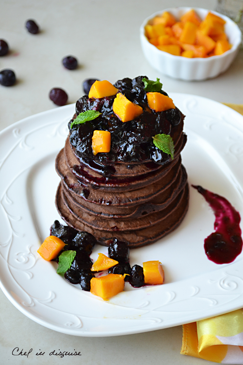 Chocolate pancakes with blueberry sauce