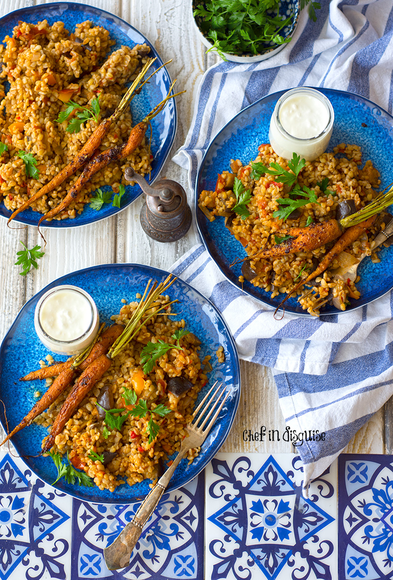 Middle eastern eggplant bulgur pilaf. Creamy eggplant, warm spices and earthy nutty bulgur served with garlic sumac baby carrots and greek yogurt. A true feast for the taste buds